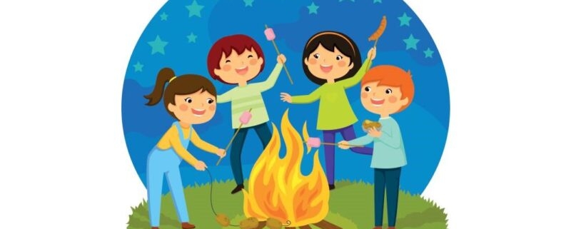 Happy kids having a bonfire roasting marshmallows and potatoes.