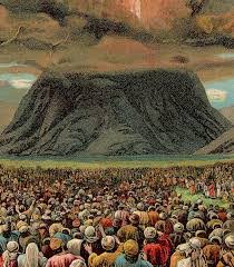 A crowd gathering around the base of Mount Sinai.
