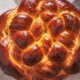 A photograph of a round challah.