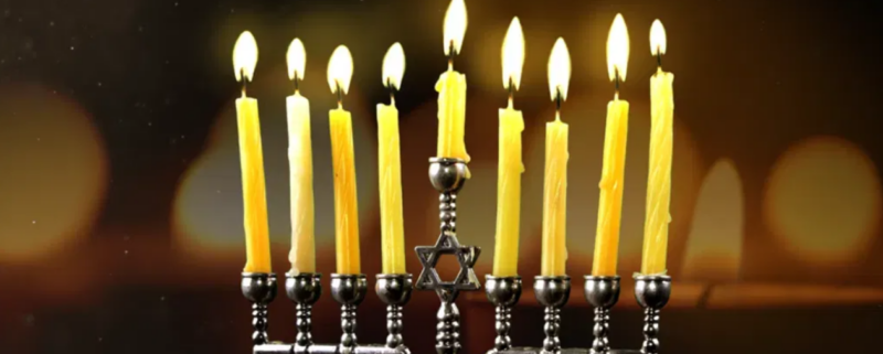 A fully-lit menorah.