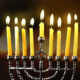 A fully-lit menorah.