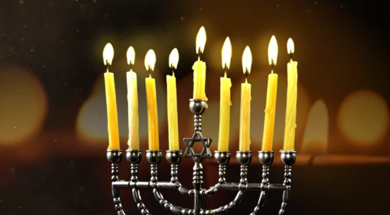 A fully-lit menorah.