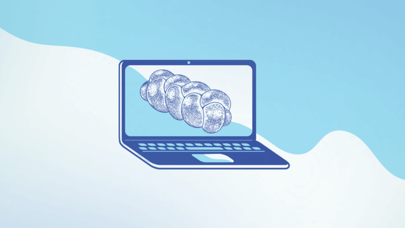 Clipart of a loaf of challah on a laptop screen.