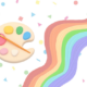 A painted rainbow next to a paint palette
